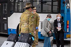 9RQR soldiers assist the movement of international arrivals into quarantine at Brisbane
